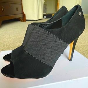 Black suede high heels by Calvin Klein